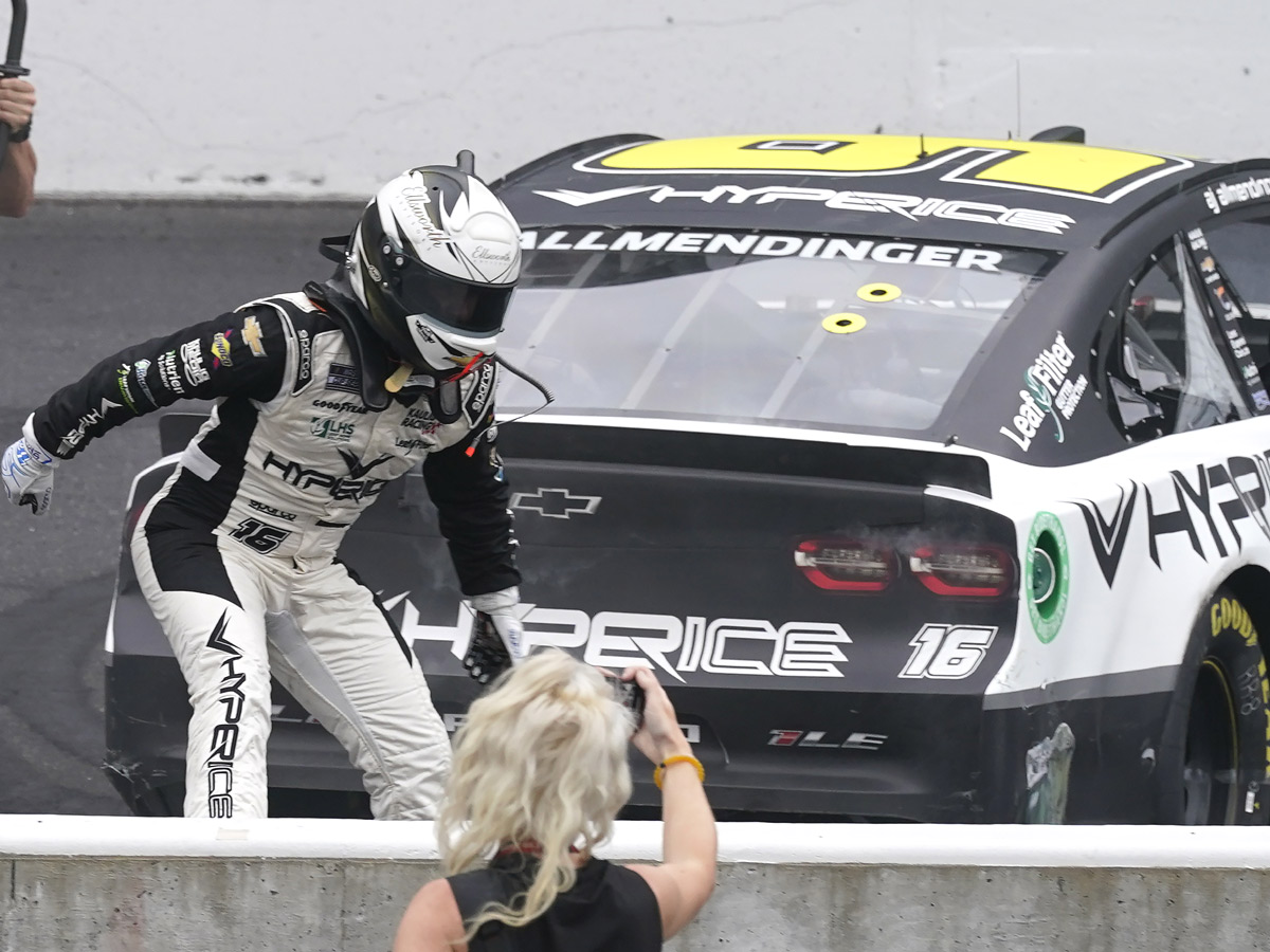 AJ Allmendinger celebrates after winning a NASCAR Series auto race Photo Gallery - Sakshi5