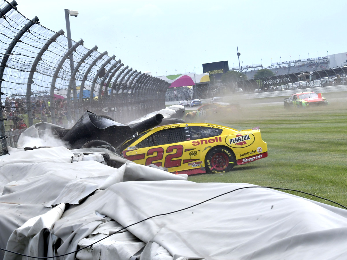 AJ Allmendinger celebrates after winning a NASCAR Series auto race Photo Gallery - Sakshi7