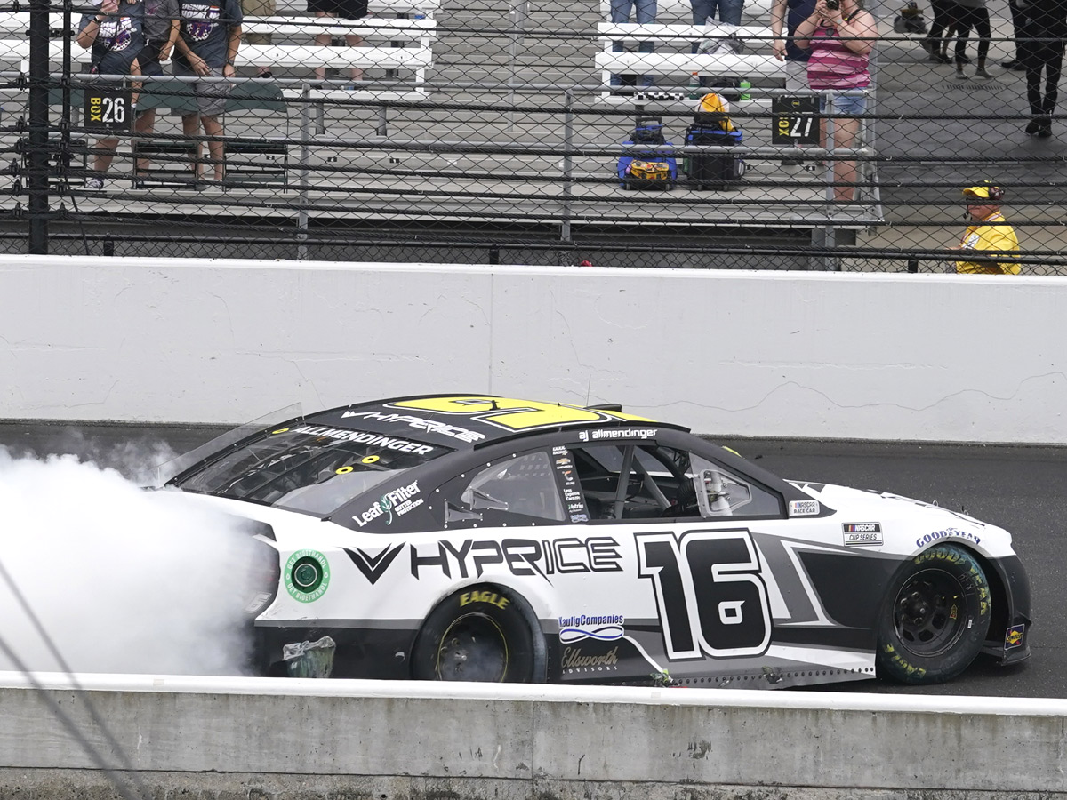 AJ Allmendinger celebrates after winning a NASCAR Series auto race Photo Gallery - Sakshi9