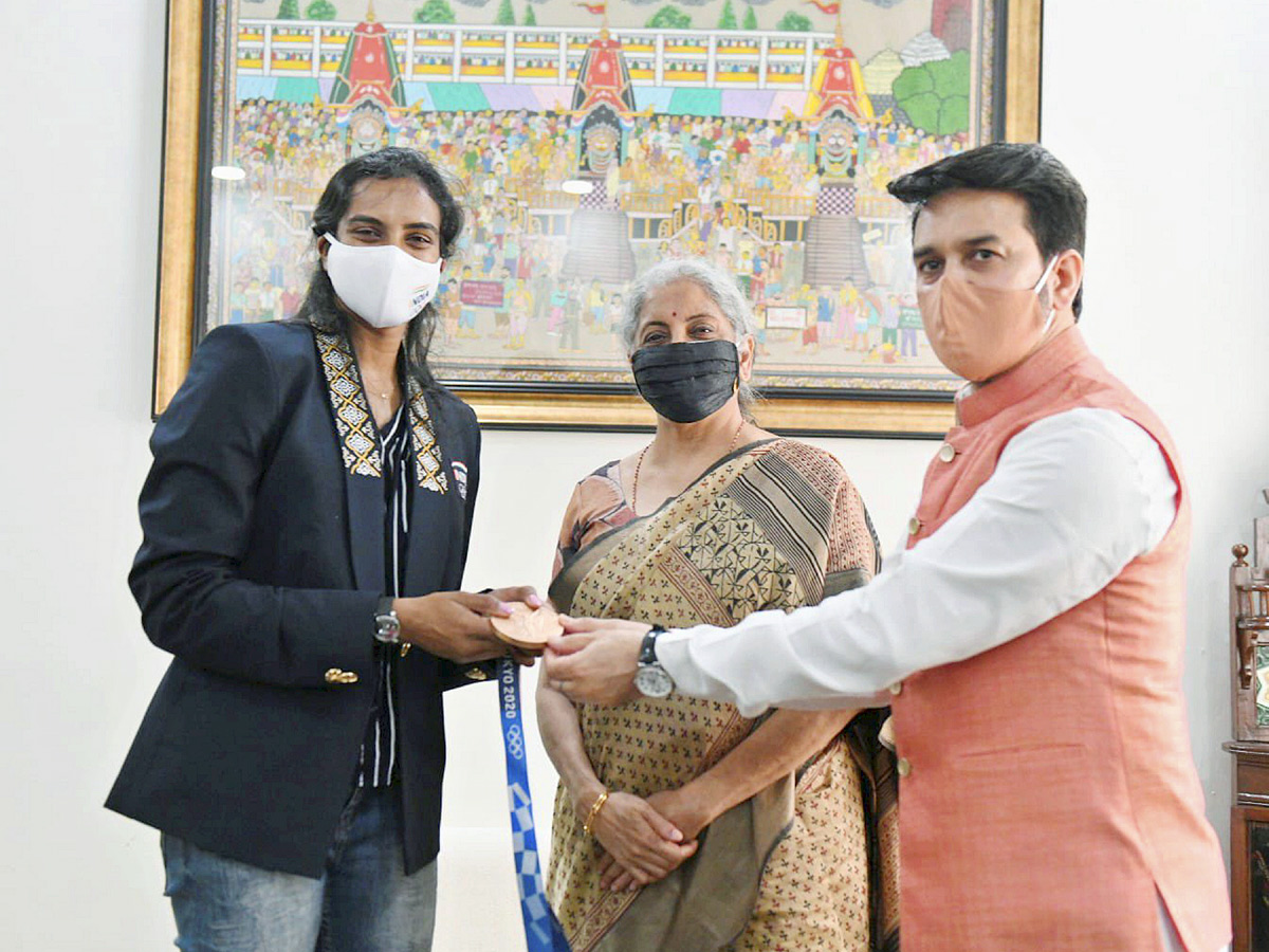 PV Sindhu receives grand welcome at Delhi airport Photo Gallery - Sakshi11