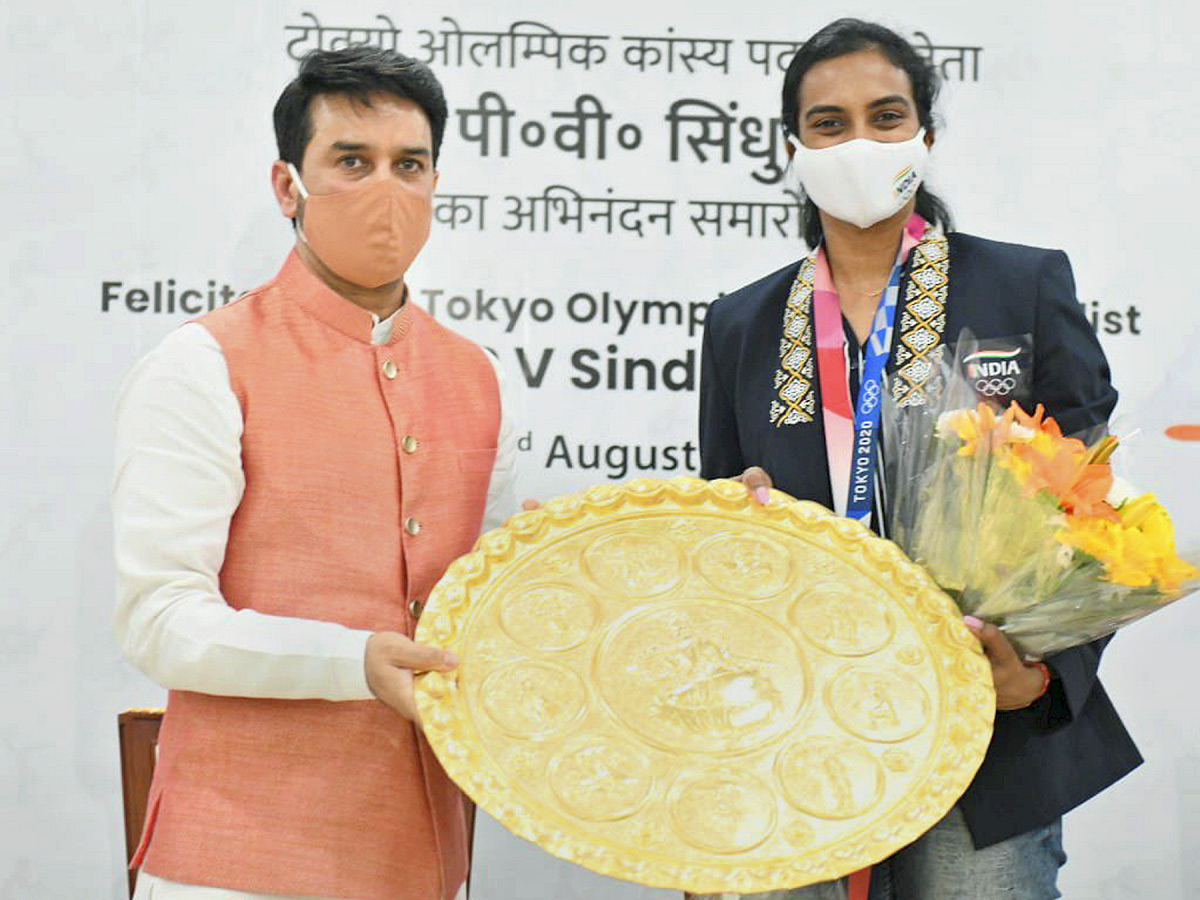 PV Sindhu receives grand welcome at Delhi airport Photo Gallery - Sakshi8