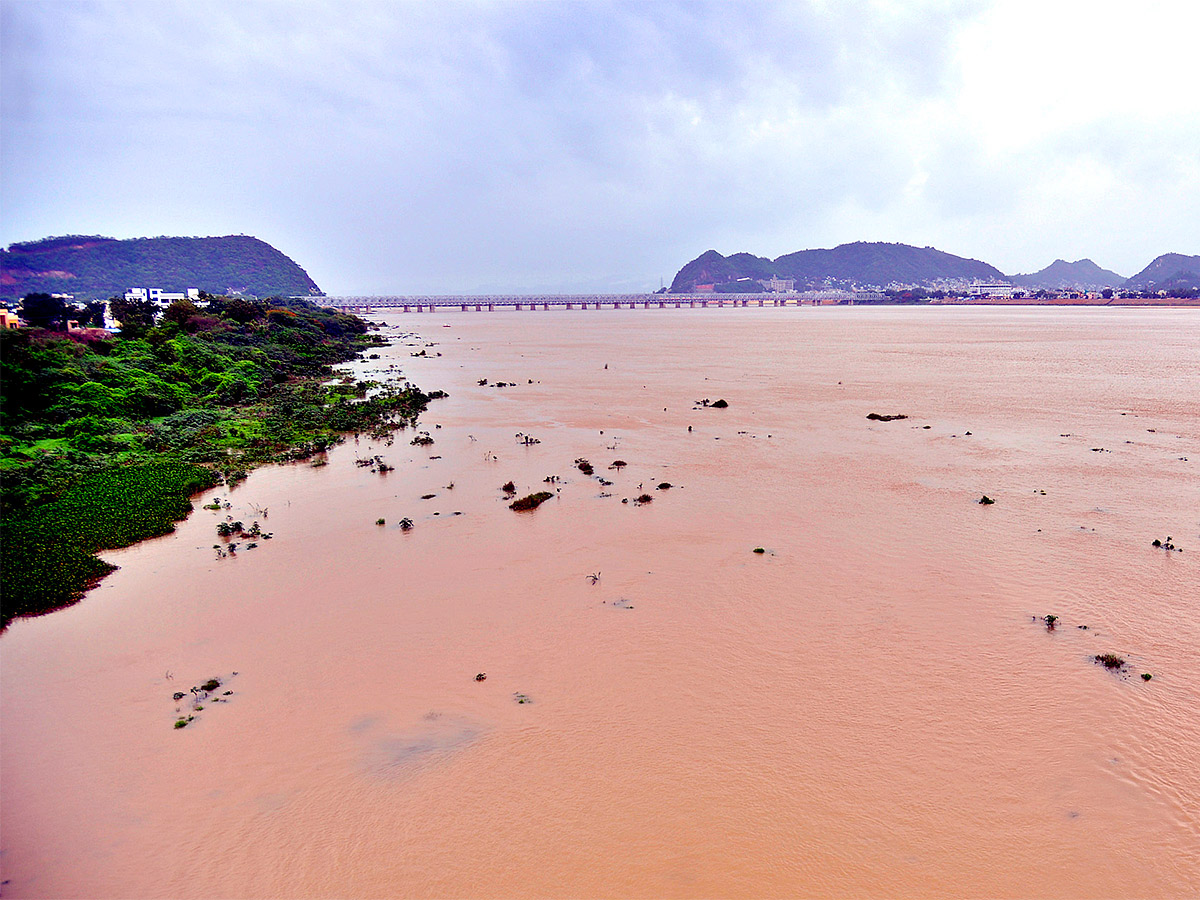 Huge Flood hit In Prakasam Barrage - Sakshi10