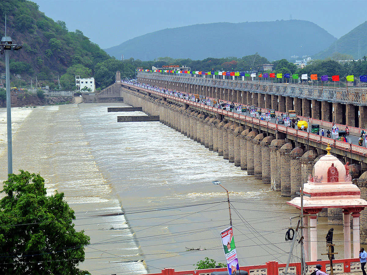 Huge Flood hit In Prakasam Barrage - Sakshi16