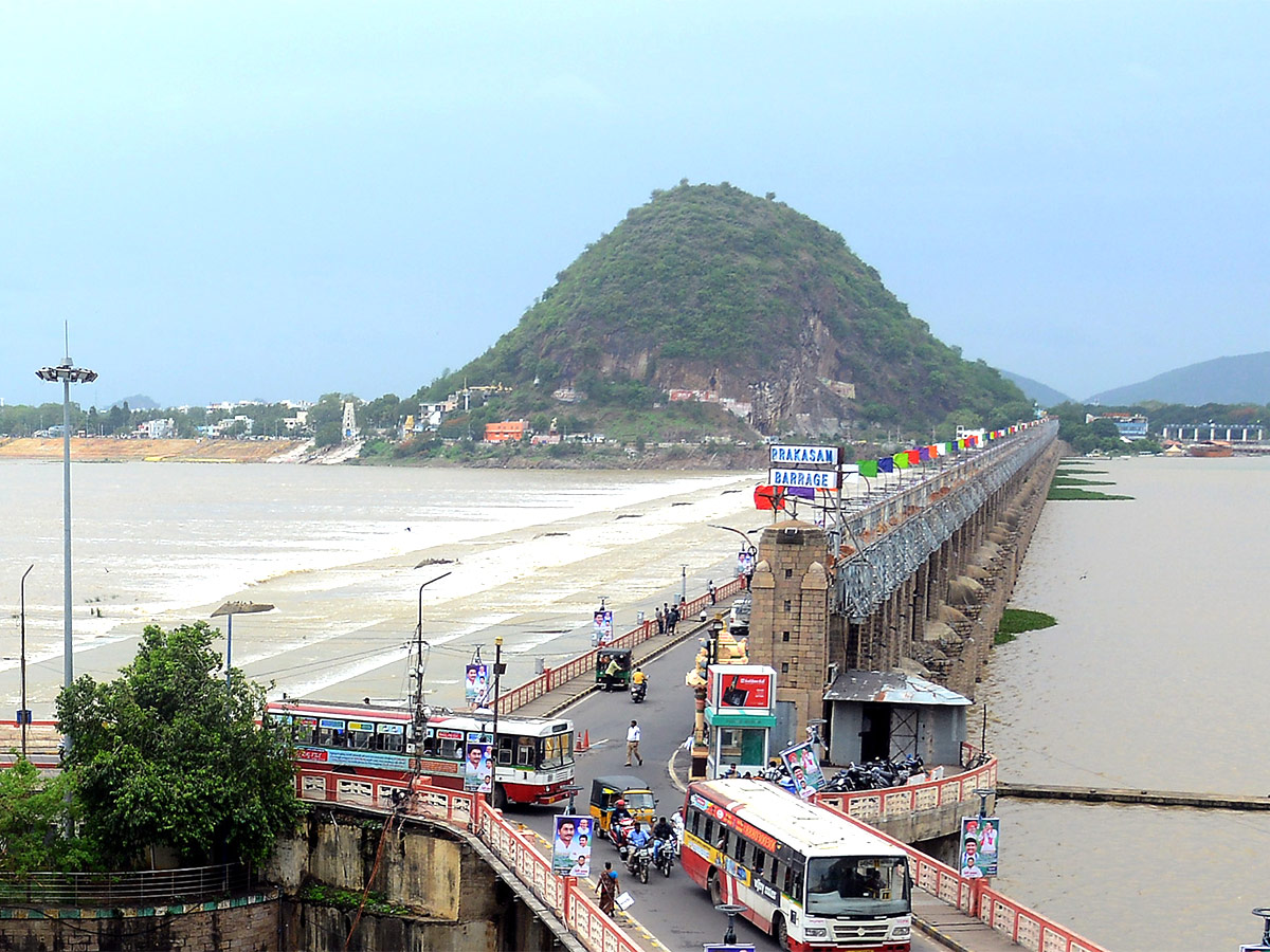 Huge Flood hit In Prakasam Barrage - Sakshi4