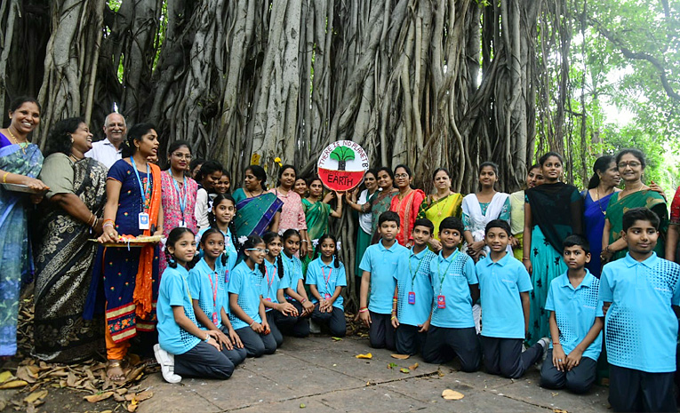 Students tie Rakhi to hundred years of history old banyan tree in Visakhapatnam Photos13