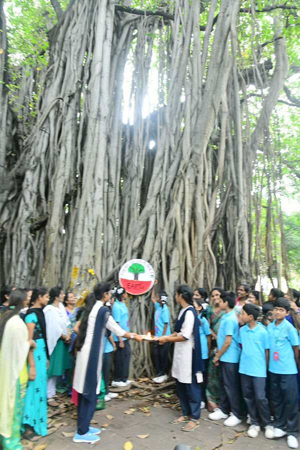 Students tie Rakhi to hundred years of history old banyan tree in Visakhapatnam Photos3
