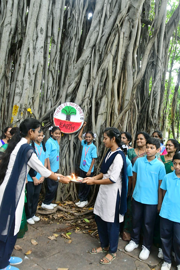 Students tie Rakhi to hundred years of history old banyan tree in Visakhapatnam Photos5