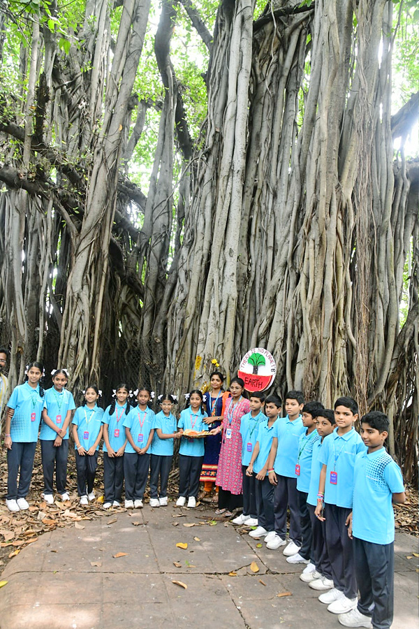 Students tie Rakhi to hundred years of history old banyan tree in Visakhapatnam Photos9