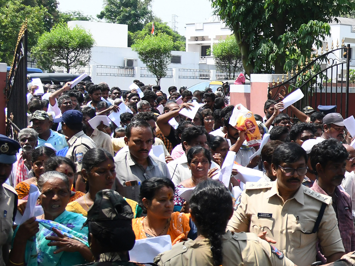 Vijayawada flood victims gathered outside the collector's office photo gallery. [node:summary]1