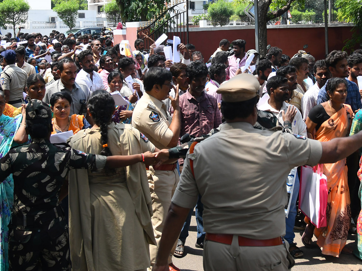 Vijayawada flood victims gathered outside the collector's office photo gallery. [node:summary]11