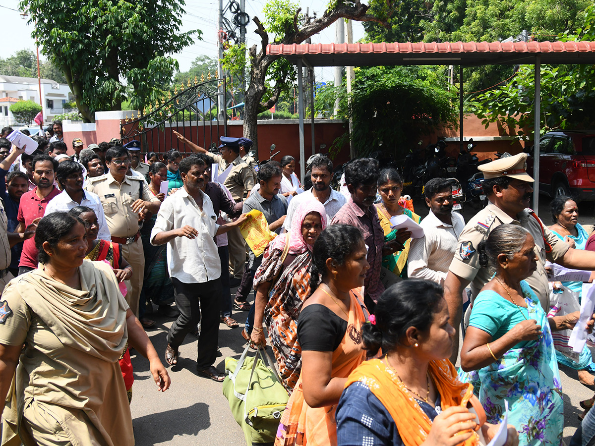 Vijayawada flood victims gathered outside the collector's office photo gallery. [node:summary]12