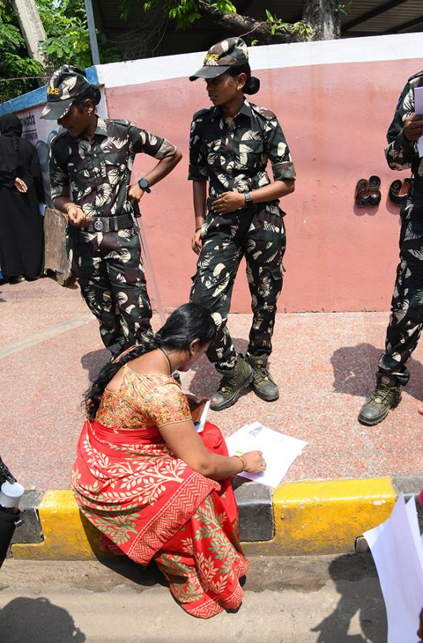 Vijayawada flood victims gathered outside the collector's office photo gallery. [node:summary]23