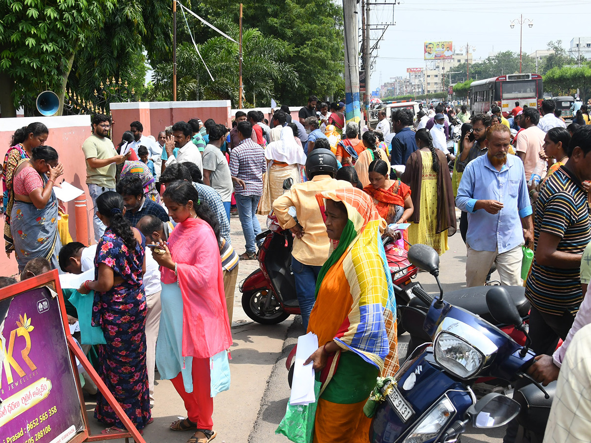 Vijayawada flood victims gathered outside the collector's office photo gallery. [node:summary]24