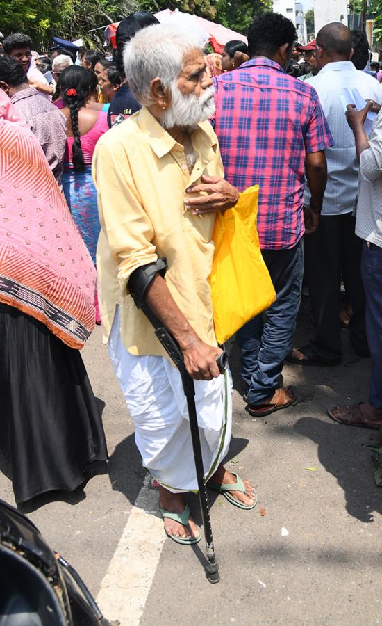 Vijayawada flood victims gathered outside the collector's office photo gallery. [node:summary]25