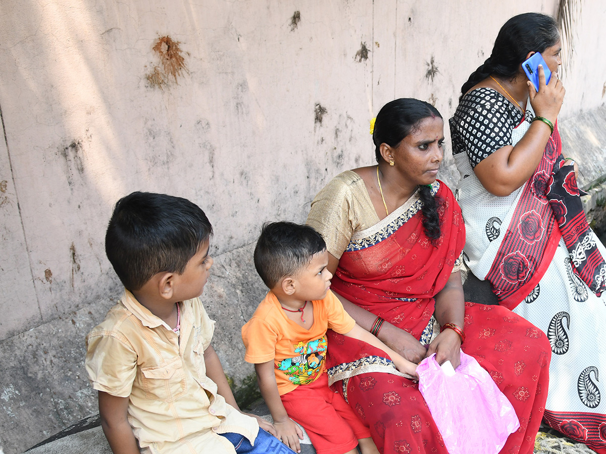 Vijayawada flood victims gathered outside the collector's office photo gallery. [node:summary]26