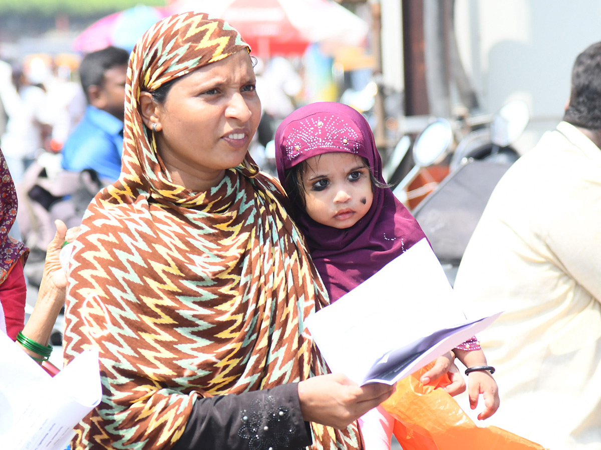 Vijayawada flood victims gathered outside the collector's office photo gallery. [node:summary]27
