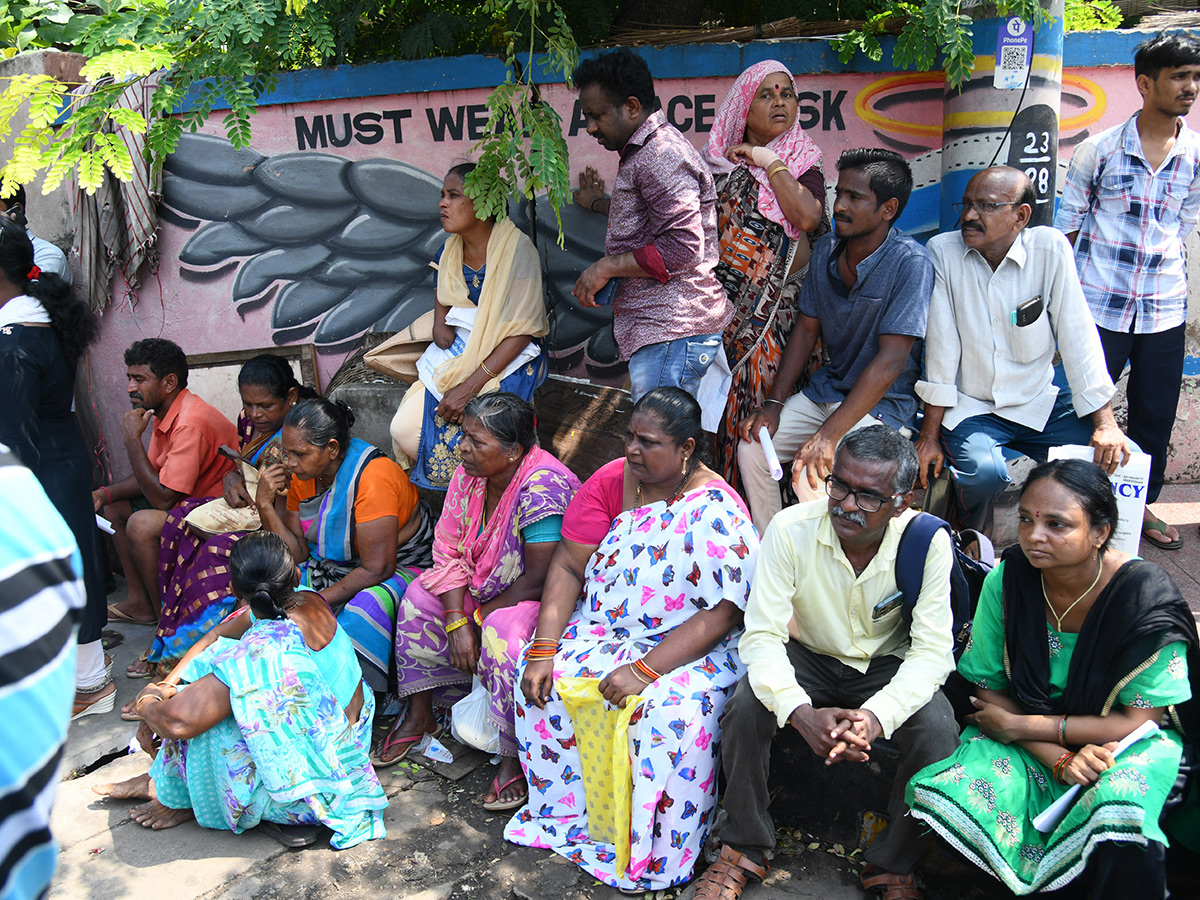 Vijayawada flood victims gathered outside the collector's office photo gallery. [node:summary]28