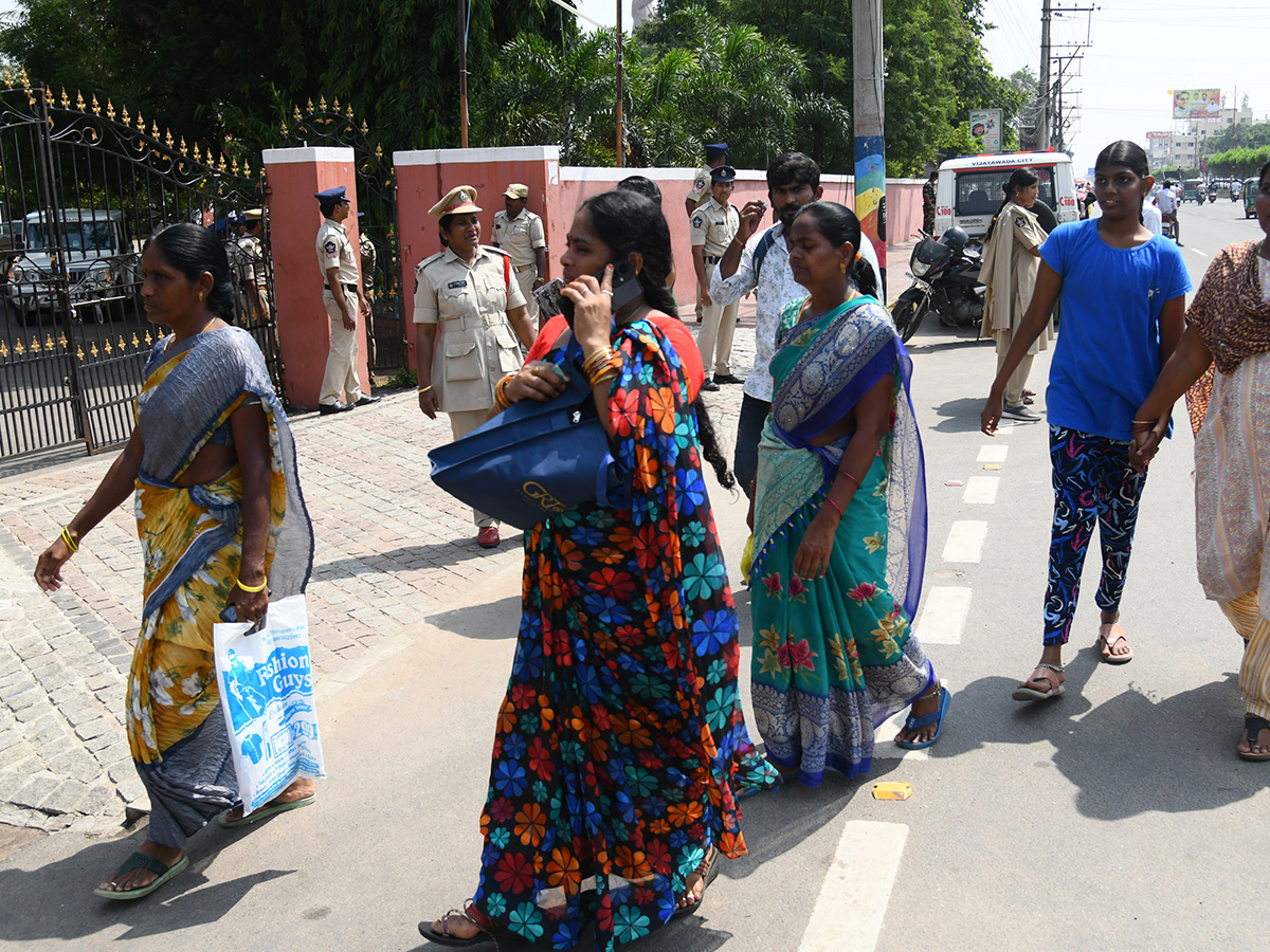 Vijayawada flood victims gathered outside the collector's office photo gallery. [node:summary]4