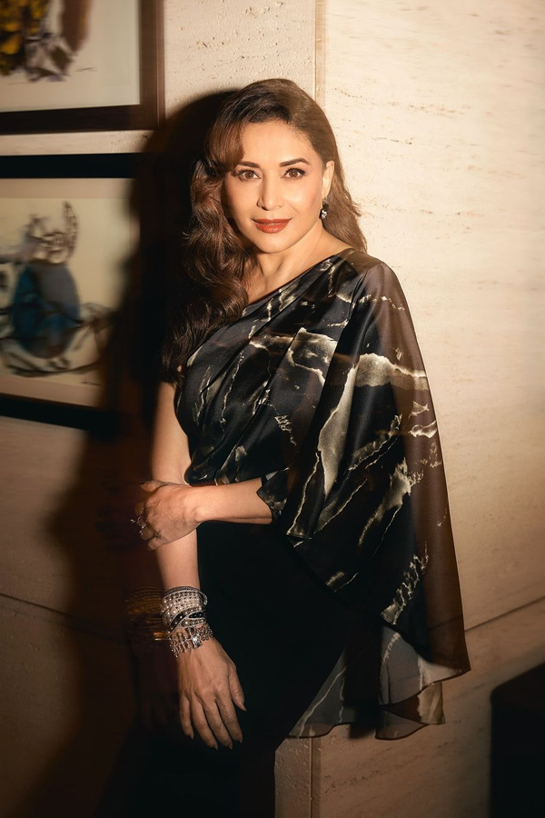Actress Madhuri Dixit Dazzling Photos In Golden Color Dress11