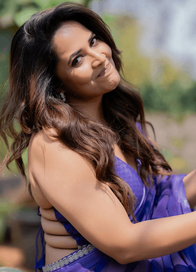 Actress Anasuya Bharadwaj Mesmerizing Photos In Blue Saree3