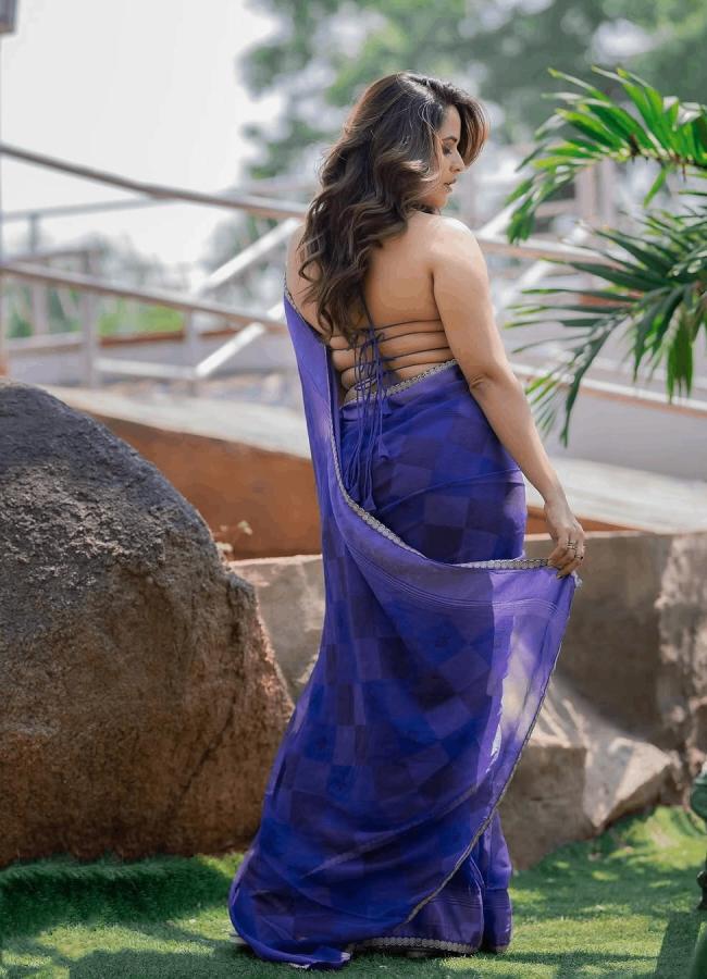 Actress Anasuya Bharadwaj Mesmerizing Photos In Blue Saree10