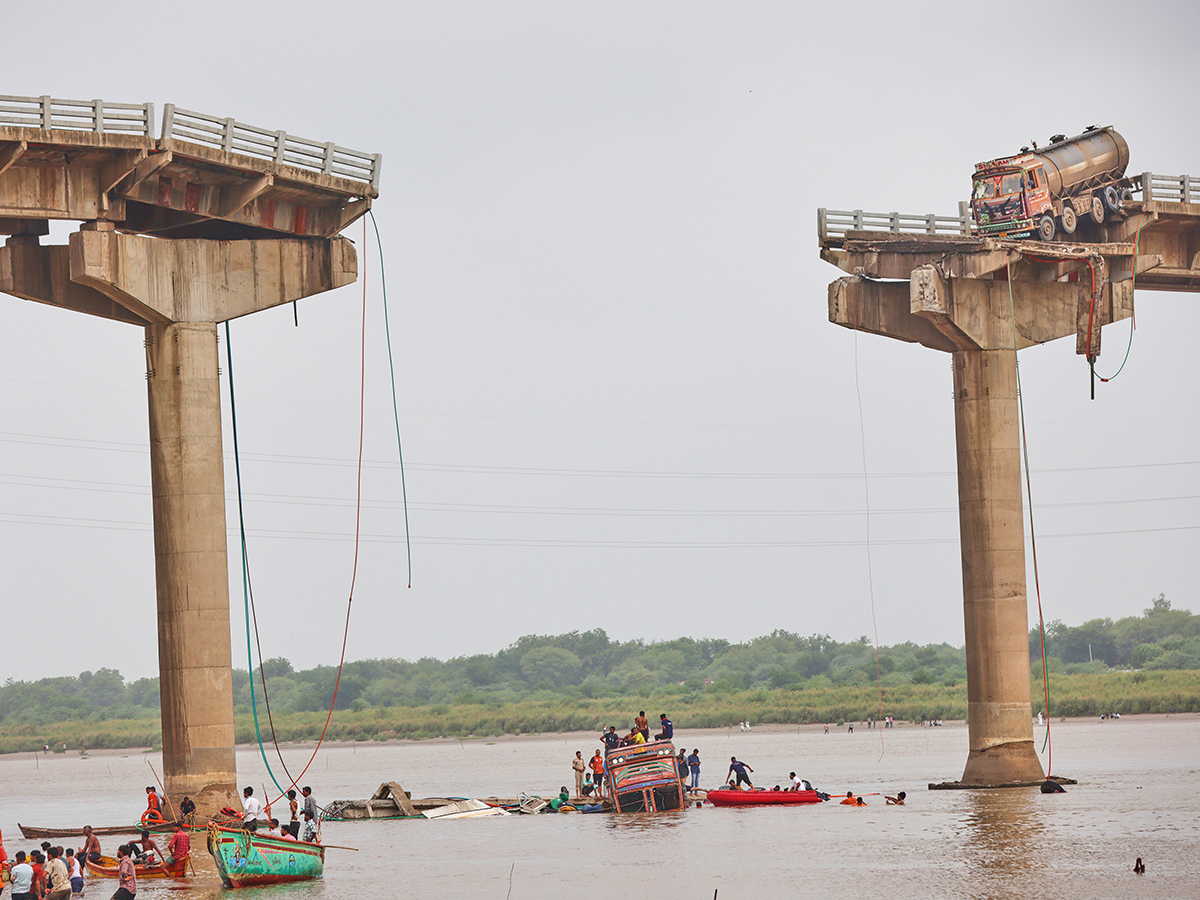 river following the collapse of a portion of a bridge in Mujpur near Vadodara 1