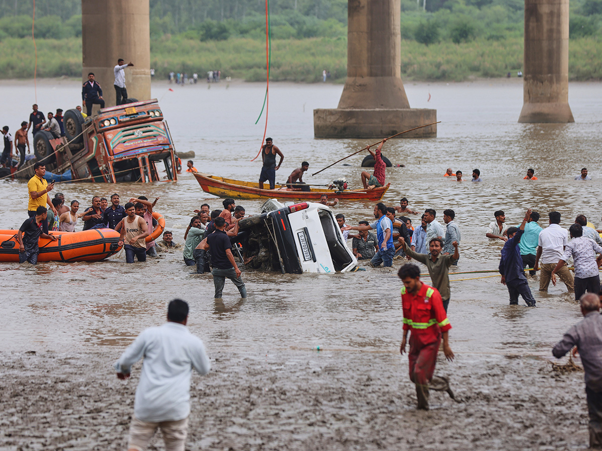 river following the collapse of a portion of a bridge in Mujpur near Vadodara 2