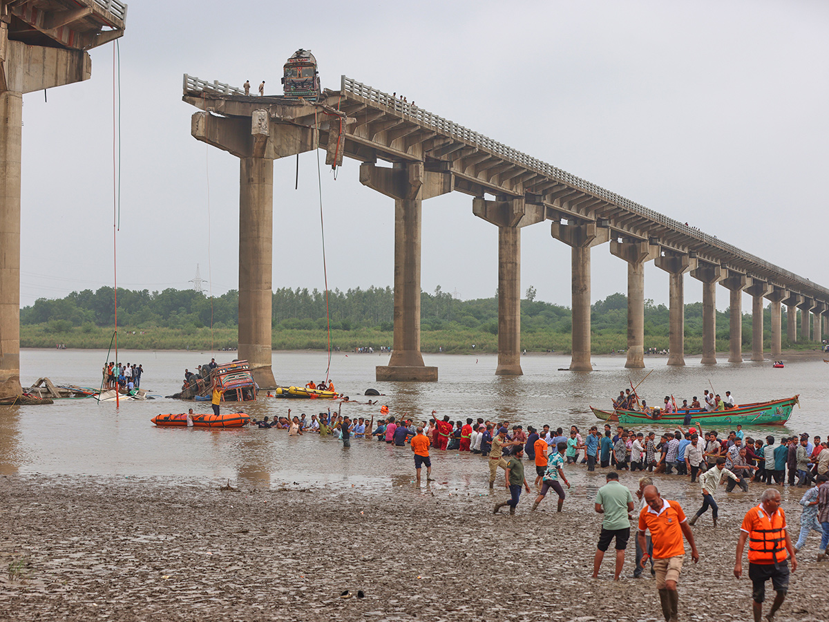 river following the collapse of a portion of a bridge in Mujpur near Vadodara 3