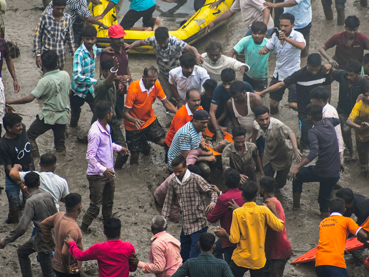 river following the collapse of a portion of a bridge in Mujpur near Vadodara 8