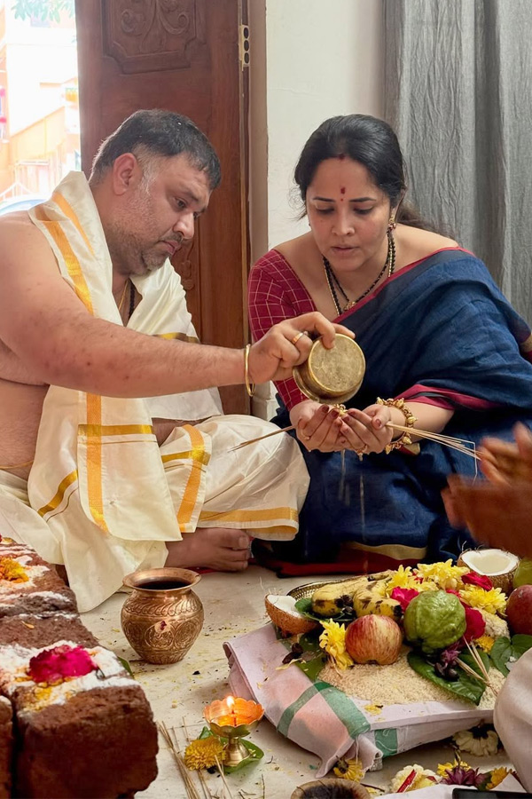 Anchor Anasuya Performs special pooja in home by Family Photos2
