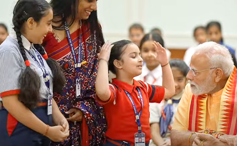 Prime Minister Narendra Modi celebrates Raksha Bandhan with kids Photos11