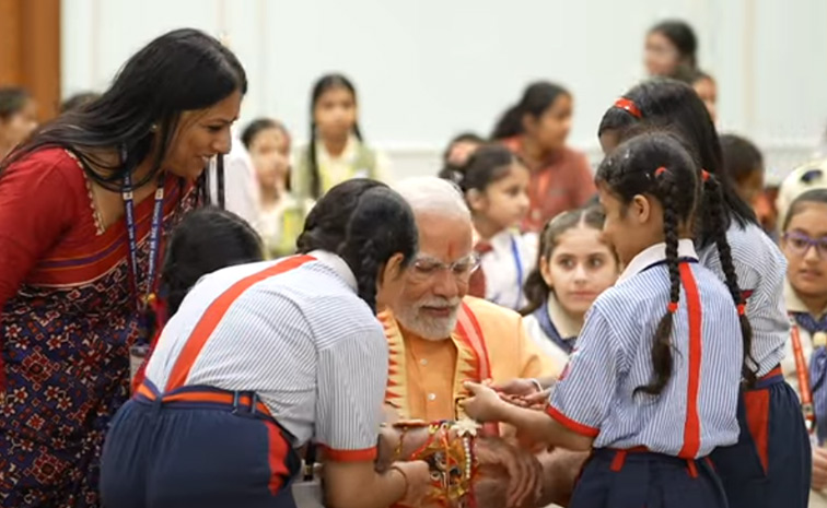 Prime Minister Narendra Modi celebrates Raksha Bandhan with kids Photos12