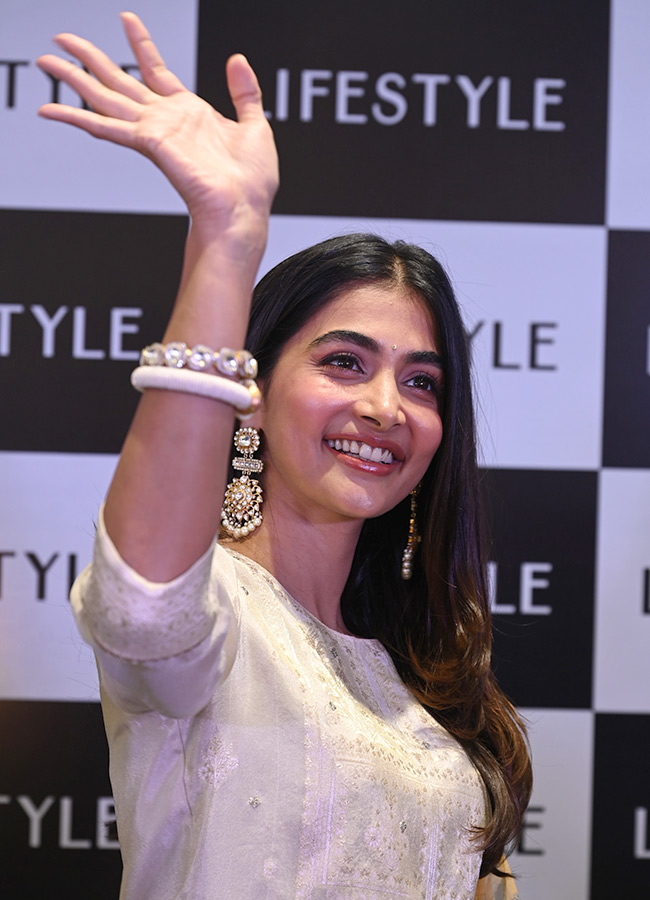 Actress Pooja Hegde buzz in Madhapur Photos 10