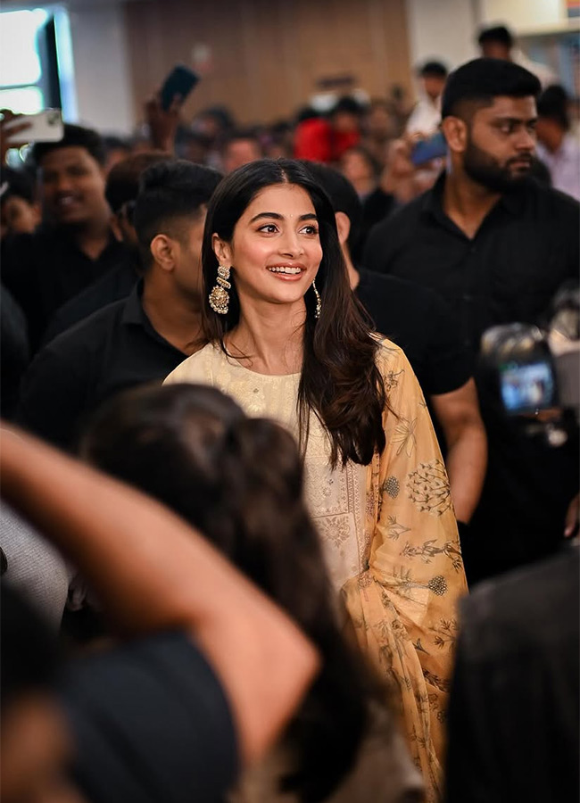 Actress Pooja Hegde buzz in Madhapur Photos 13