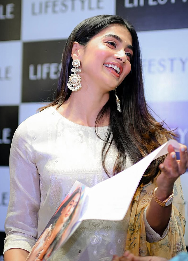 Actress Pooja Hegde buzz in Madhapur Photos 14