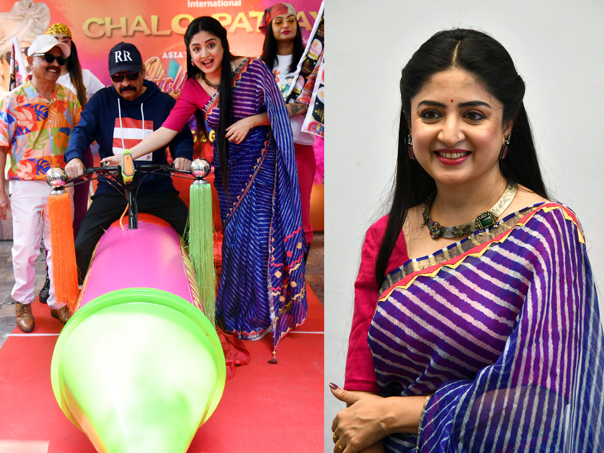 Actress Poonam Kaur Spray Gun Car In Hyderabad1