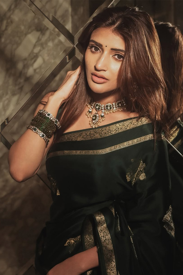 Actress Sreeleela Looks Absolutely Adorable In a Graceful Green Saree Photos2