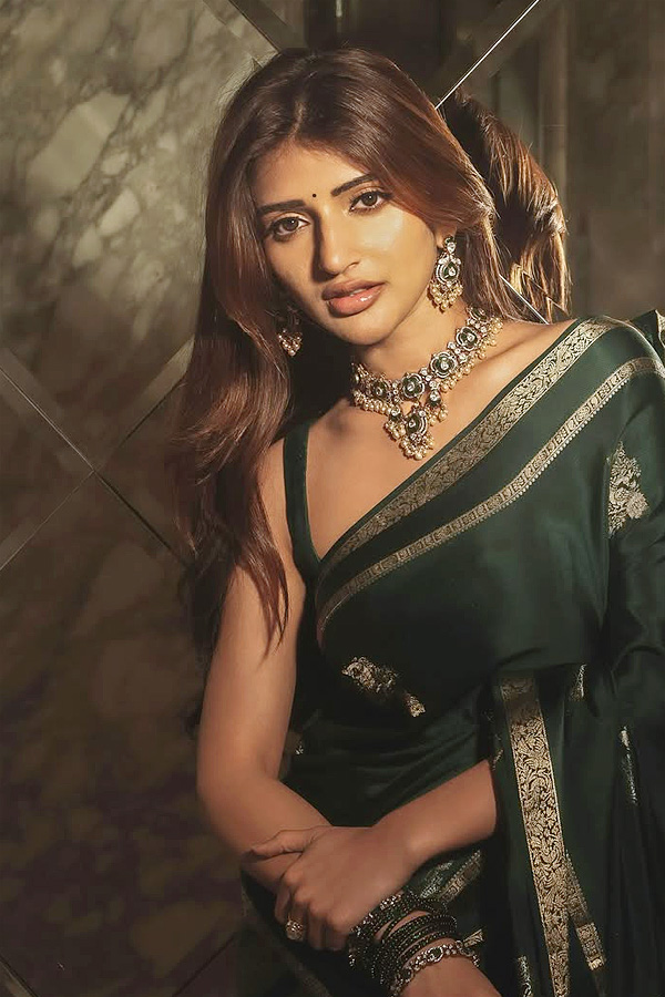 Actress Sreeleela Looks Absolutely Adorable In a Graceful Green Saree Photos4