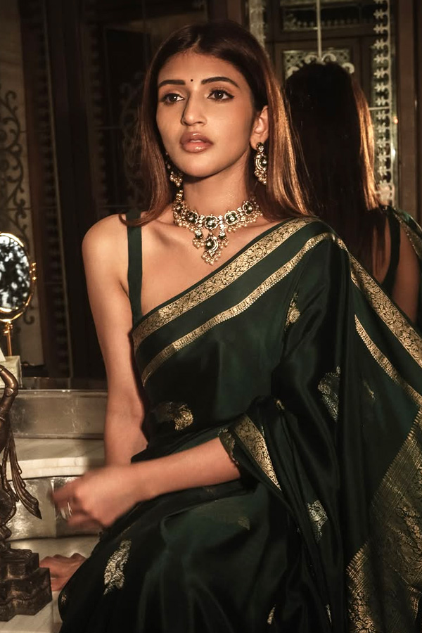 Actress Sreeleela Looks Absolutely Adorable In a Graceful Green Saree Photos5