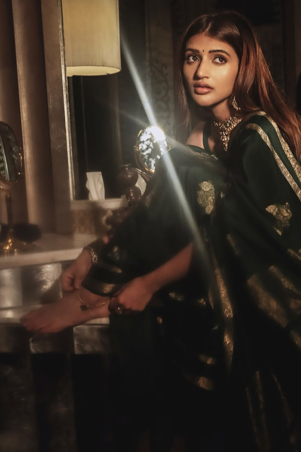 Actress Sreeleela Looks Absolutely Adorable In a Graceful Green Saree Photos7