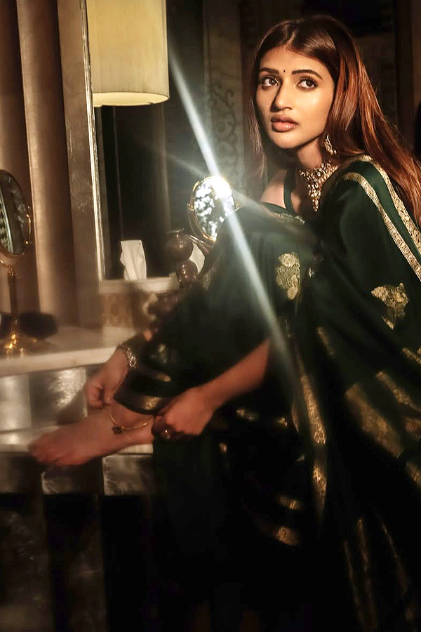 Actress Sreeleela Looks Absolutely Adorable In a Graceful Green Saree Photos8