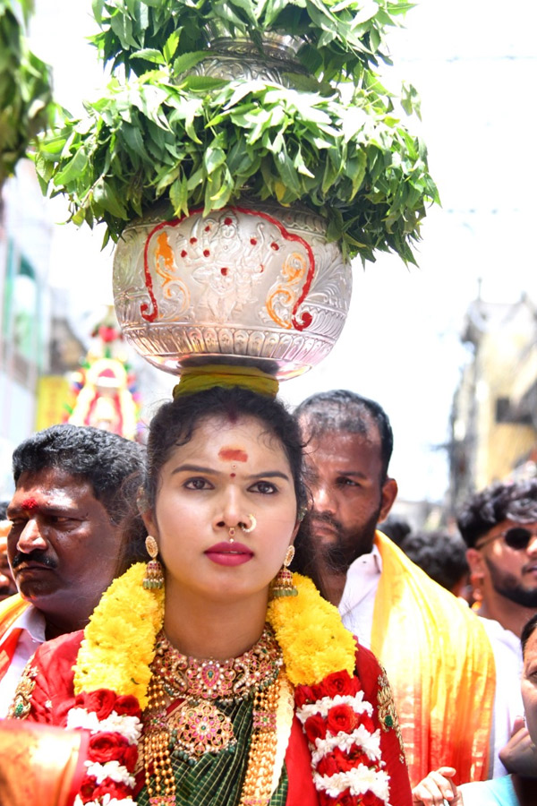 Devotees from Telangana offer Bonalu To Goddess Kanaka Durga In Vijayawada Photos13