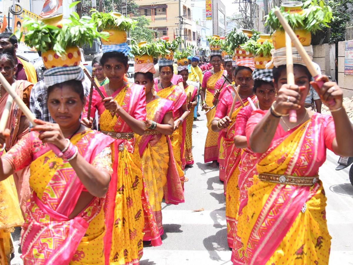 Devotees from Telangana offer Bonalu To Goddess Kanaka Durga In Vijayawada Photos24