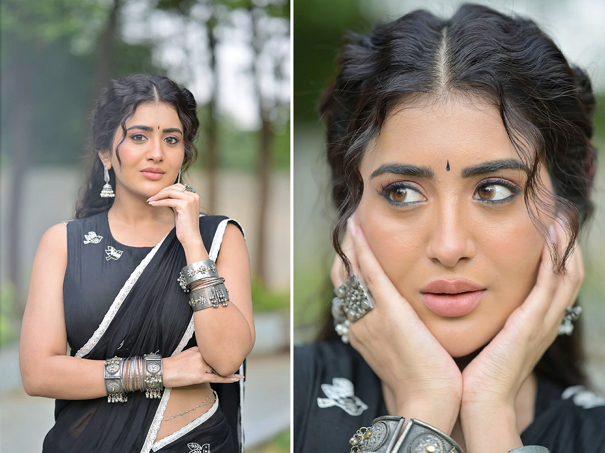 Raashi Looks Stunning in a Black Saree with Red Flowers Photos1