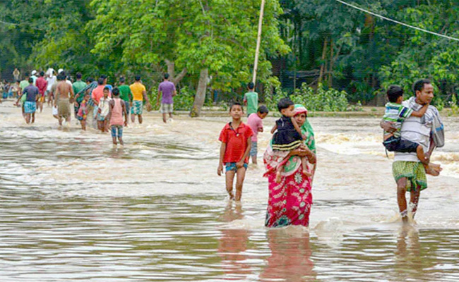 https://www.sakshi.com/sites/default/files/article_images/2020/05/25/assam-floods2.jpg