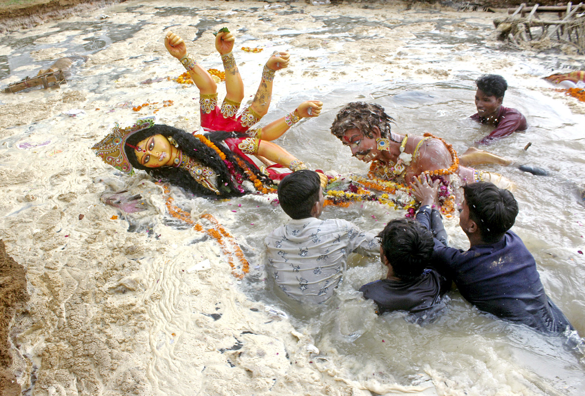 Devi Durga Being Immersed In Ganga River - Sakshi