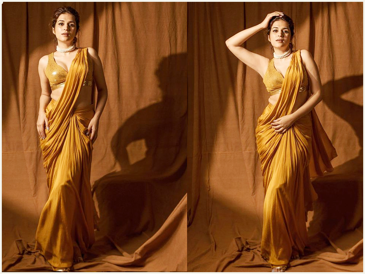 Shraddha Das Glamorous Look In A Mustard Saree  - Sakshi