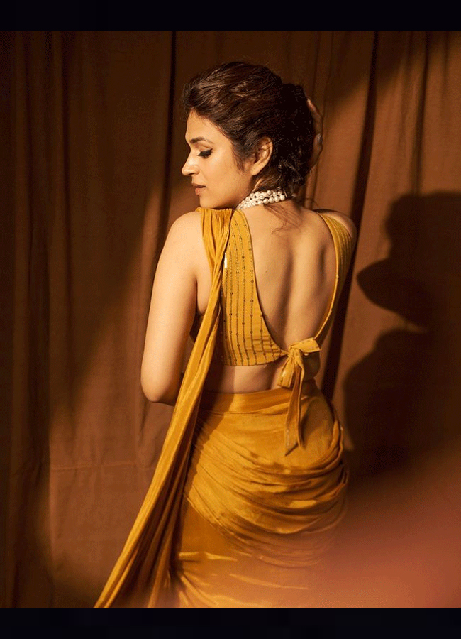 Shraddha Das Glamorous Look In A Mustard Saree  - Sakshi