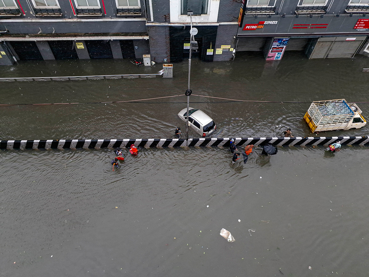 Cyclone Michaung As Rain Floods Chennai - Sakshi