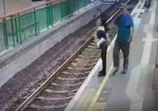 Man pushes woman on rail track